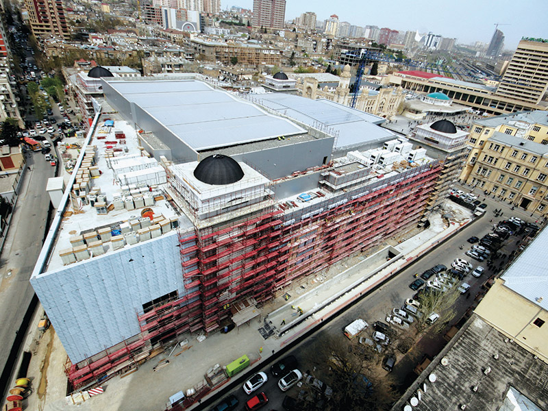 Dismantling existing ramp, additional slab construction and strengthening of existing columns.